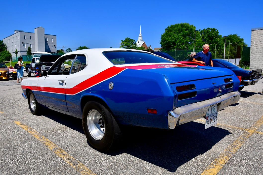 Rear Profile View on a Red White and Blue 1970 Plymouth Duster