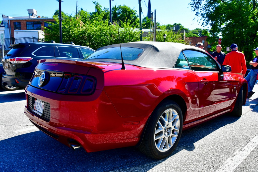 Rear Side View of a Red Ford Mustang Convertible
