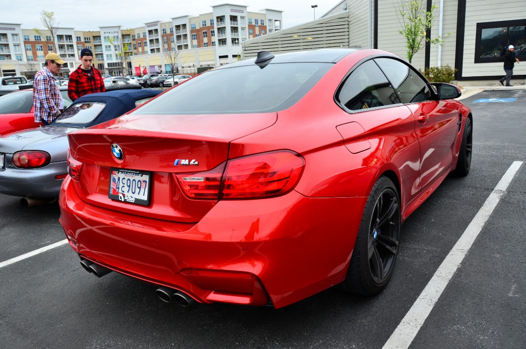 Rear Profile of a Red BMW M4 Rear Profile of a Red BMW M4