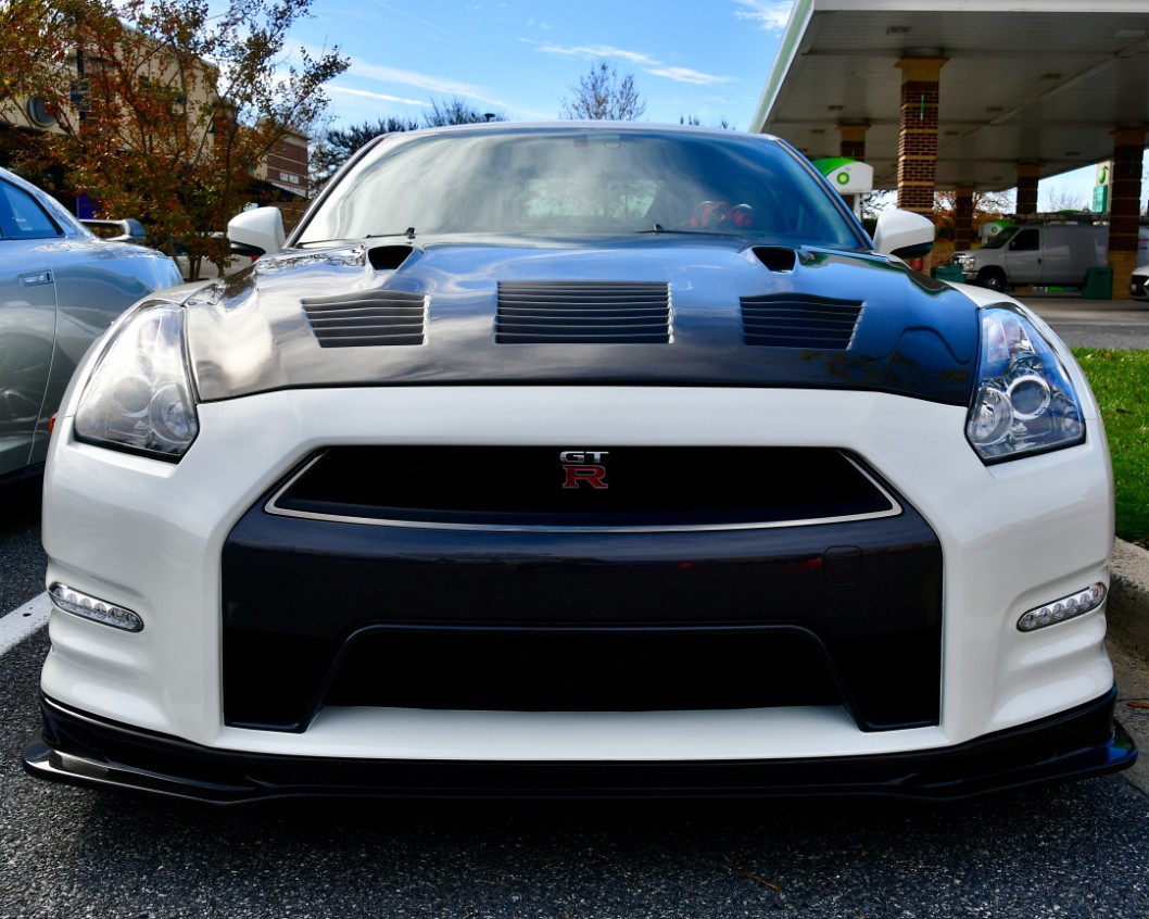 Facing a Nissan GT-R in White and Black