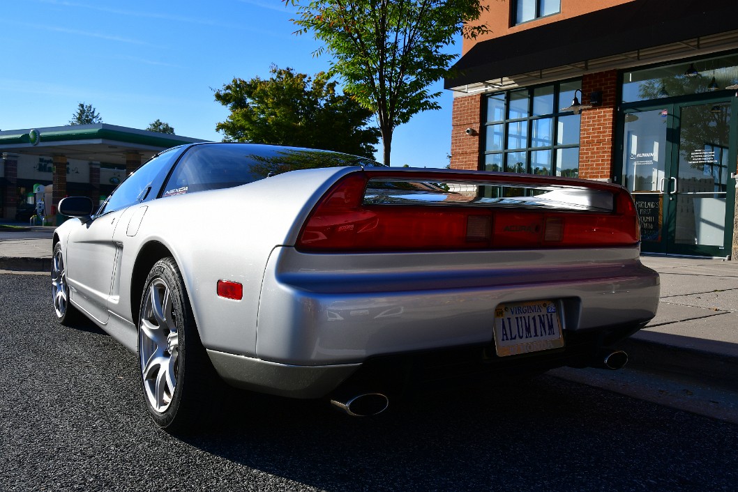 Rear Side View of a Classic Silver Acura NSX