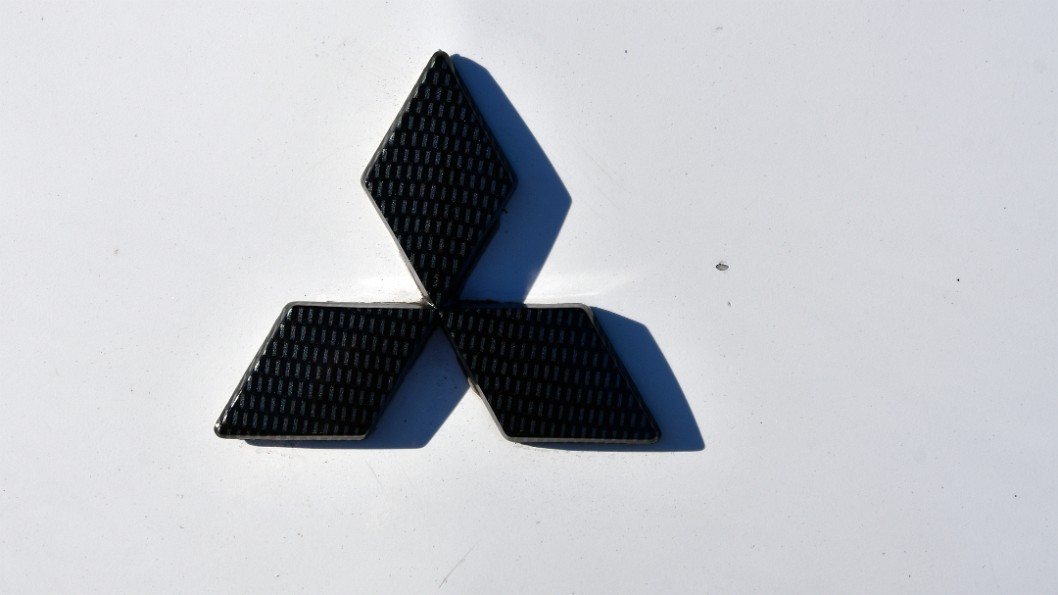 Mitsubishi Badge in Carbon Fiber Cover