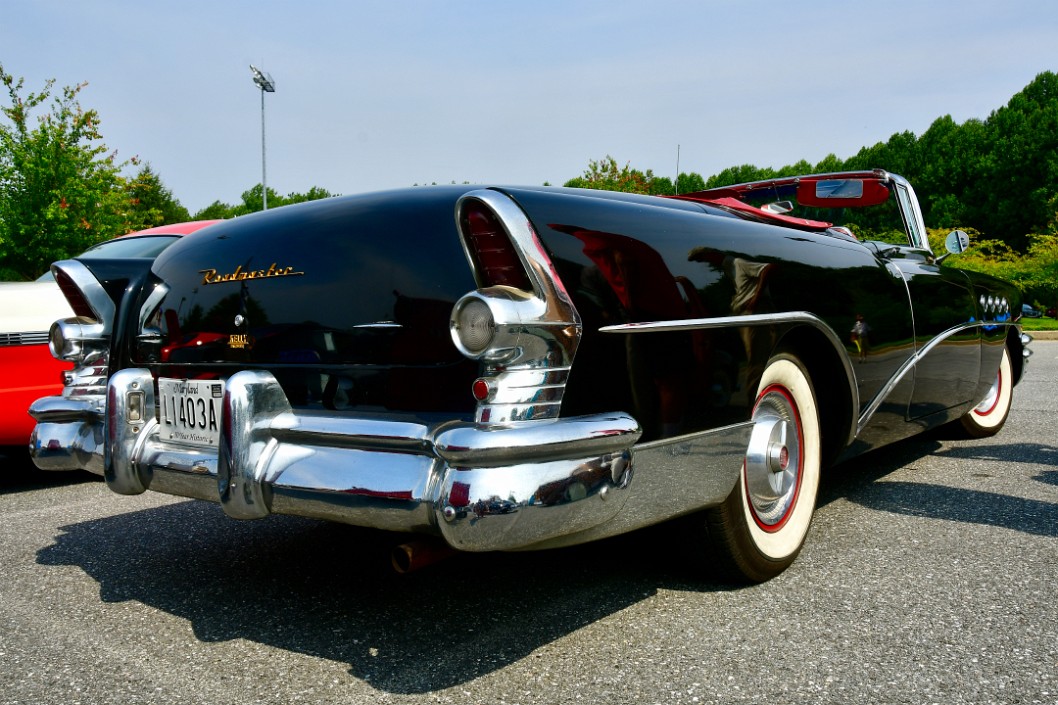Rear Profile View of a 1955 Buick Roadmaster Convertible in Black and Chrome